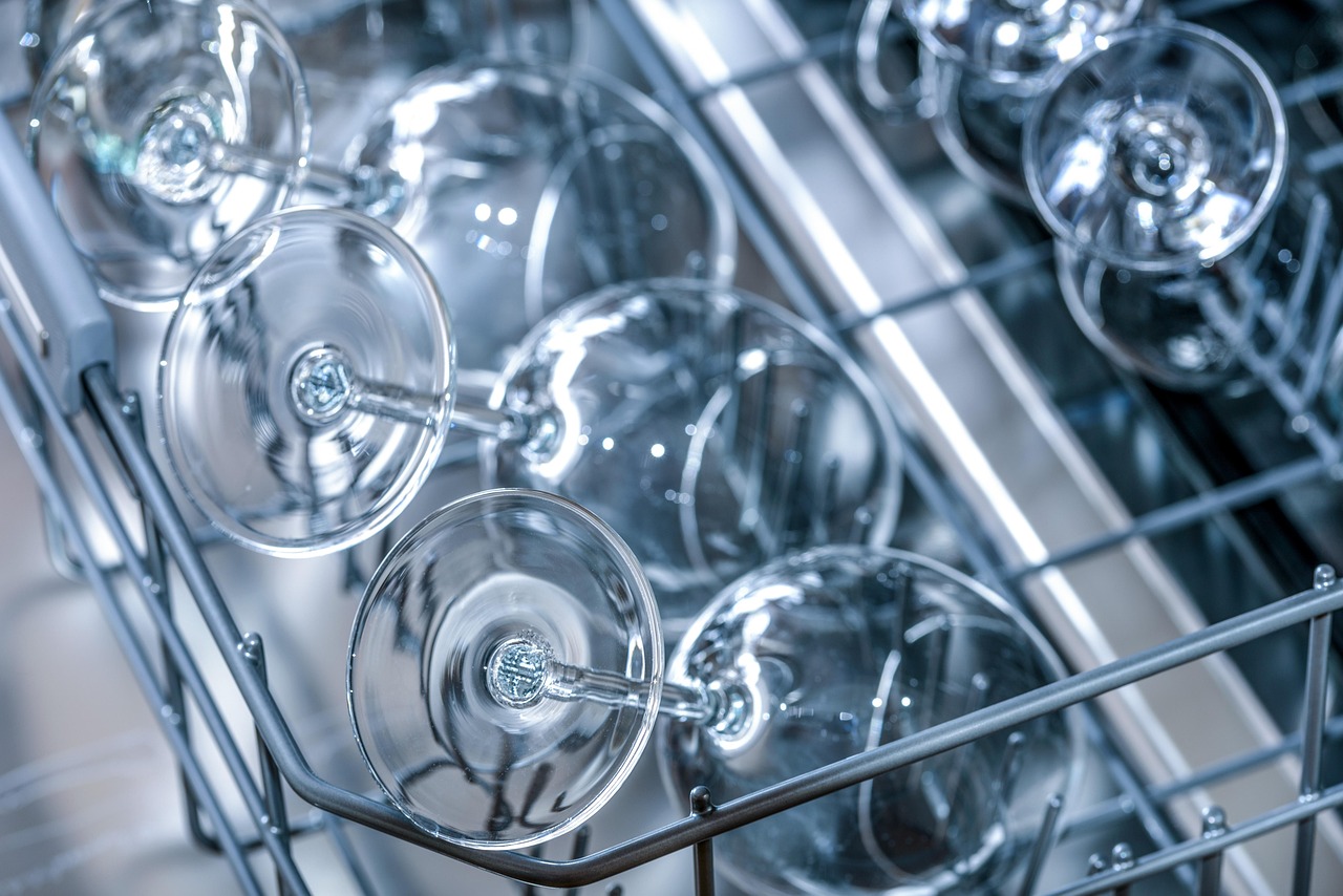 Technician repairing a dishwasher